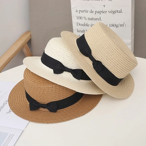 Flat top straw sun hats for women in khaki, beige and brown with black ribbon bows