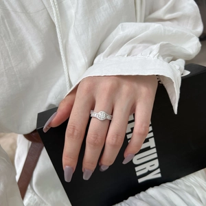 Close-up of elegant S925 sterling silver ring with sparkling round and baguette zircons
