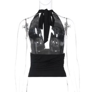 Detail of black halter neck top with tie-up design and pleated cinched waistline