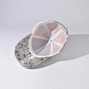 Chinese floral baseball hat interior showing 100% polyester wash label and metal buckle