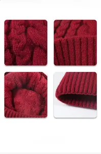 Detail view of red cable knit hat featuring soft fleece lining and ribbed fold design