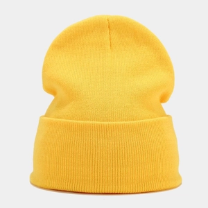 Detail of bright yellow knit beanie showing fine texture and wide fold-over cuff design
