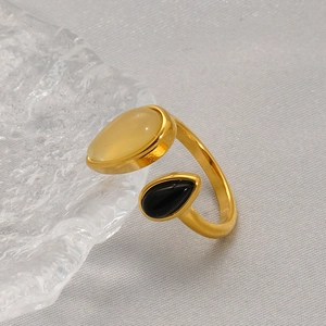 Dual-stone open ring featuring yellow crystal and black agate on a gold-plated base