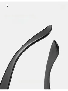 Detail of ergonomic curved black glasses temples with a high-gloss polished finish