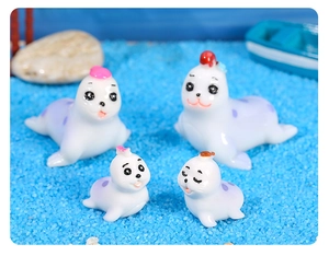 Miniature resin seal figurines with purple spots on blue sand for ocean micro landscapes
