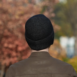 Men's winter knit beanie in dark grey, thick ribbed texture for cold weather protection