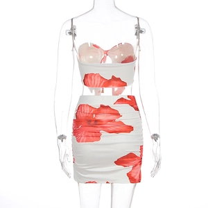 Detailed back view of a white floral two-piece set featuring a halter top and bodycon skirt