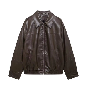 Detail of dark brown faux leather bomber jacket with metal zipper and ribbed cuffs
