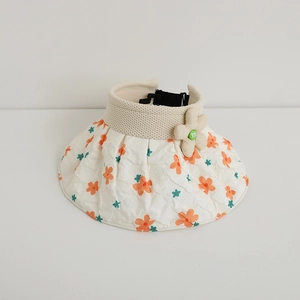 Detail of the bubble fabric floral brim and fabric flower on this girls sun visor hat
