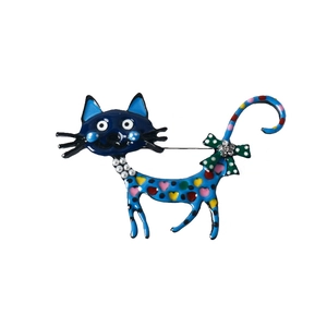 Detail of blue colorful cat brooch with painted dots, faux pearls and rhinestone bow