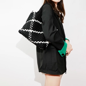 Minimalist woven tote bag with black and white plaid design for stylish professional women