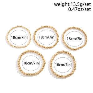 Detail view of 5-piece gold beaded heart bracelet set with weight and 18cm size labels