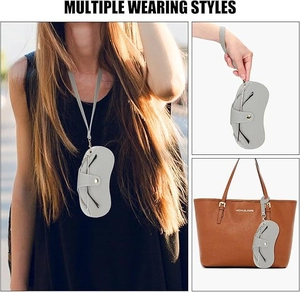 Grey leather glasses pouch showing multiple ways to wear via neck strap and hand strap