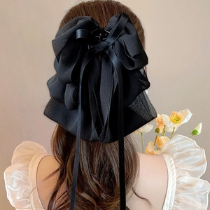 Grande pince à cheveux élégante en mousseline noire avec nœud stylisée à l'arrière