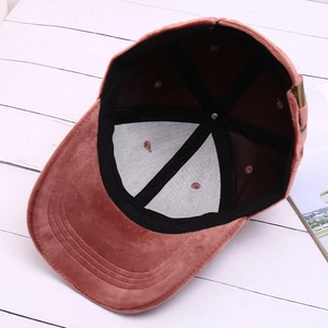 Pink velvet baseball cap showing inner lining, sweatband and adjustable metal buckle