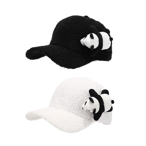 Detail view of black and white lamb fleece baseball caps with 3D panda doll ornaments