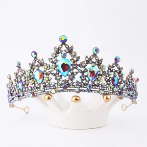 Detailed close-up of a vintage bronze bridal tiara with colorful rhinestones and crystals