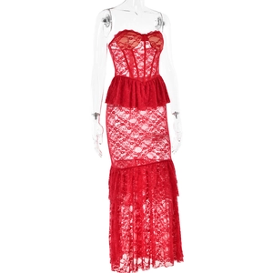 Detail of red lace tube dress featuring tiered ruffles and intricate floral patterns