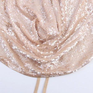 Champagne sequin two-piece set featuring cowl neck halter top and fishtail skirt