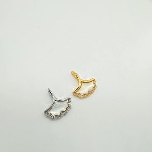 18k gold plated ginkgo fan pendant with white shell and crystal stones on white background