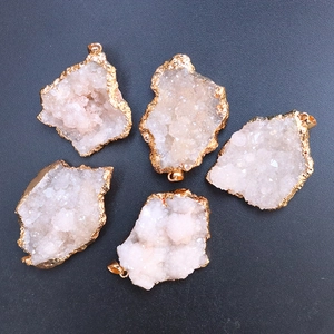 Macro view of irregular natural rainbow crystals with elegant gold-plated edges