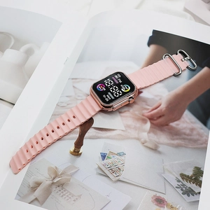Detail view of pink silicone strap and rose gold square metal case with health metrics