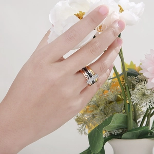 Multi-tone stackable stainless steel rings with crystal bar and mixed shell texture