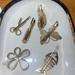 Juego de pinzas doradas para el pelo con formas creativas de tijeras, peines y mariposas