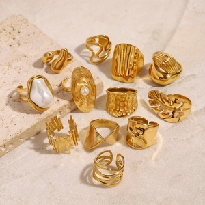 Set of 12 gold stainless steel rings featuring irregular pearls and textured designs