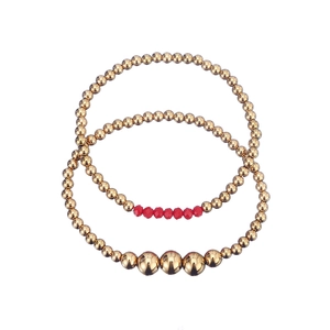 Waterproof stainless steel golden bead bracelet set with red crystal accents for women