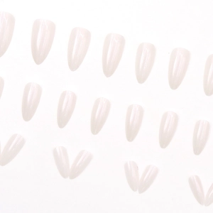 Translucent milky white almond shaped press-on nails with a soft pearlescent finish