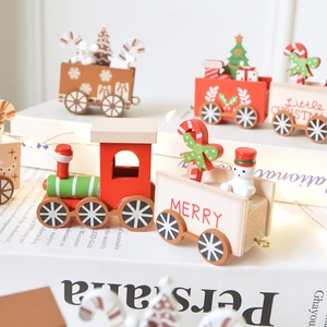 Handcrafted wooden Christmas train set with festive snowman and tree decorations