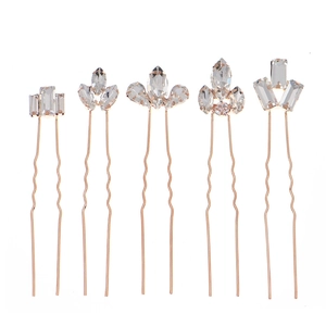 Five pieces of gold U-shaped bridal hair pins with marquise crystal rhinestone accents