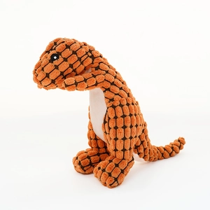 Detail of orange corduroy pet toy showing plush dinosaur texture and durable material