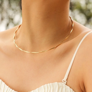 Elegant gold twisted torque necklace for women in minimalist stainless steel jewelry style