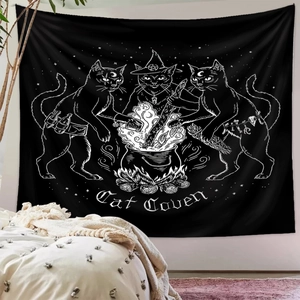 Detail of black cat coven wall tapestry hanging on a bedroom wall as home decoration