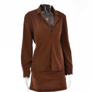 Detail view of dark brown two-piece set featuring V-neck long sleeve top and mini skirt