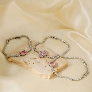Three elegant silver bracelets with pink heart, square and clover cubic zirconia stones