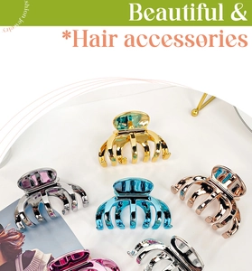 Close-up of metallic claw clips in multiple vibrant colors with high-gloss finish