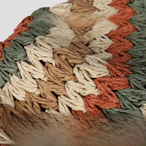 Close-up of handmade multi-color crochet straw hat showing flexible woven texture
