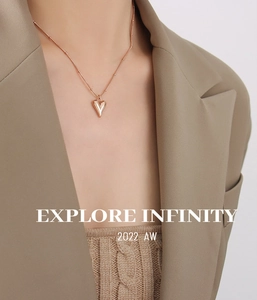 Close-up of heart pendant necklace in rose gold finish on professional model