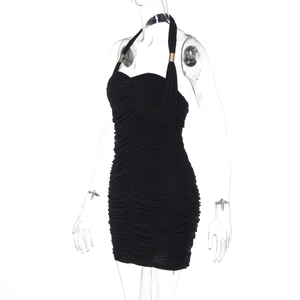 Detail of black ruched bodycon dress showing neck strap and golden metal hardware