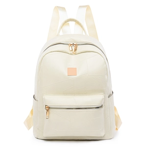 Detail of cream faux leather backpack with pebble texture and golden zipper hardware