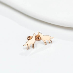 Elegant rose gold wolf stud earrings in a howling silhouette on a white display
