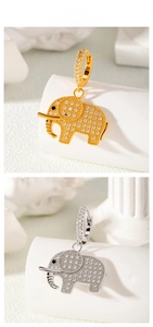 Détail de boucles d'oreilles éléphant en cuivre avec micro-incrustations de zircone