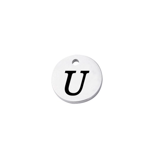 Macro detail of silver mirror stainless steel round tag with engraved uppercase letter U