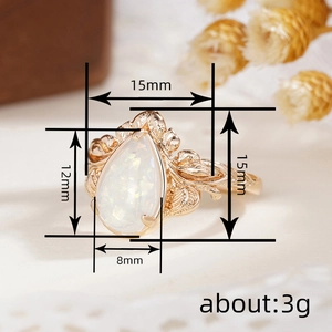 Golden leaf ring with pear-cut opal and floral texture, 15mm width product dimension