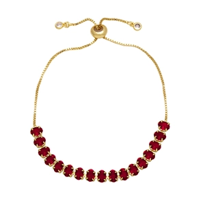 Detail of adjustable gold bracelet with sixteen oval-cut dark red cubic zirconia stones
