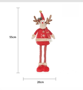 Detail view of small telescopic Christmas reindeer doll with red hat and 55cm height scale
