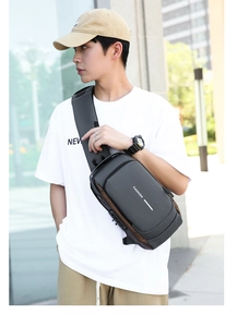 Detail of waterproof black men's chest bag with anti-theft combination lock and strap